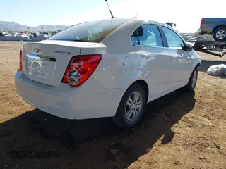 2014 Chevrolet Sonic LT z VIN 1G1JC5SH4E4171516, wystawiony jako IAAI lot #41163056 z przebiegiem 92 362 mil mil oraz . Historia ofert i sprzedaży dostępna na DreamBid. Obrazek 4.