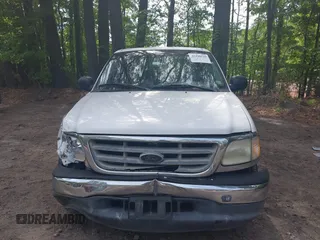 2003 Ford F-150 XLT with VIN 1FTRW07663KD69809, listed as a IAAI auction lot 42198549 with 166,466 mi miles and . Bid and sale history available at DreamBid. Image 12.