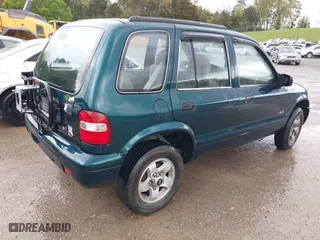 2000 Kia Sportage with VIN KNDJA7233Y5685000, listed as a IAAI auction lot 42005169 with 221,447 mi miles. Bid and sale history available at carsss.com. Image 4.