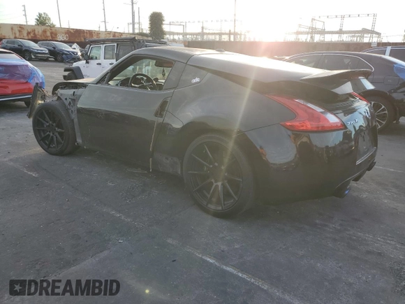 2011 Nissan 370Z Touring with VIN JN1AZ4EH6BM550267, listed as a Copart auction lot 82245804 with 124,466 mi miles and Salvage Title. Bid and sale history available at carsss.com. Image 2.