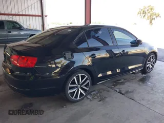 2014 Volkswagen Jetta S z VIN 3VW2K7AJ1EM311148, wystawiony jako IAAI lot #40418942 z przebiegiem 192 015 mil mil oraz . Historia ofert i sprzedaży dostępna na DreamBid. Obrazek 4.