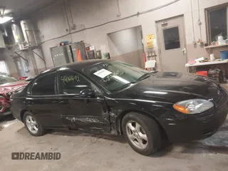 2004 Ford Taurus SE z VIN 1FAFP53U74G107504, wystawiony jako IAAI lot #42068692 z przebiegiem Nie podano mil oraz . Historia ofert i sprzedaży dostępna na DreamBid. Obrazek 13.