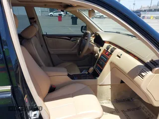 2002 Mercedes-Benz E-Class with VIN WDBJF65J62B404868, listed as a IAAI auction lot 42121837 with 107,415 mi miles. Bid and sale history available at carsss.com. Image 5.