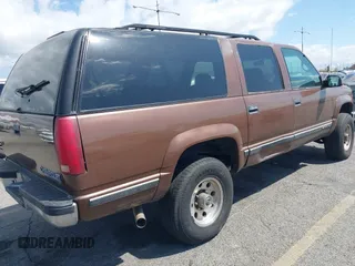 1999 Chevrolet Suburban with VIN 1GNGK26J9XJ494147, listed as a IAAI auction lot 41945149 with 102,652 mi miles. Bid and sale history available at carsss.com. Image 6.
