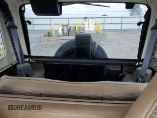 2000 Jeep Wrangler Sport z VIN 1J4FA49S9YP798353, wystawiony jako Copart lot #62009645 z przebiegiem 116 676 mil mil oraz Szkoda całkowita • Salvage title. Historia ofert i sprzedaży dostępna na DreamBid. Obrazek 10.
