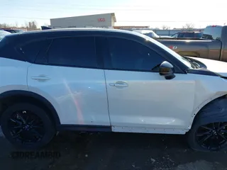 2021 Mazda CX-5 Grand Touring with VIN JM3KFBDM3M0417738, listed as a IAAI auction lot 41308123 with 90,134 mi miles. Bid and sale history available at carsss.com. Image 14.