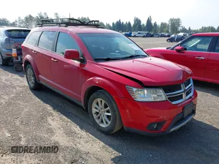 2013 Dodge Journey SXT with VIN 3C4PDDBG0DT506893, listed as a IAAI auction lot 42544375 with 176,014 mi miles and . Bid and sale history available at DreamBid. Image 1.