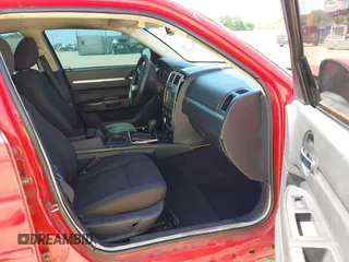 2010 Dodge Charger SXT with VIN 2B3CA3CV8AH165800, listed as a IAAI auction lot 42010412 with 180,311 mi miles. Bid and sale history available at carsss.com. Image 5.
