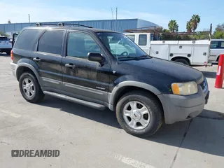 2001 Ford Escape XLT with VIN 1FMCU03181KA15501, listed as a IAAI auction lot 41857955 with 157,344 mi miles. Bid and sale history available at carsss.com. Image 1.