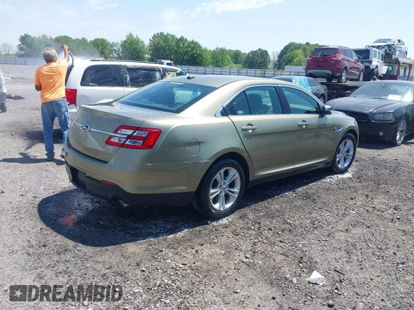 2013 Ford Taurus SEL with VIN 1FAHP2E88DG105557, listed as a IAAI auction lot 42040773 with 157,705 mi miles and . Bid and sale history available at carsss.com. Image 4.