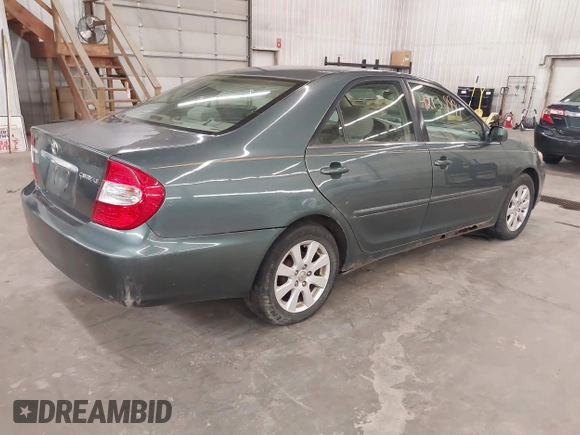 2004 Toyota Camry LE with VIN 4T1BE32K04U361670, listed as a IAAI auction lot 42139994 with 205,899 mi miles. Bid and sale history available at carsss.com. Image 4.