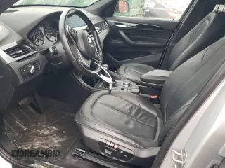 2018 BMW X1 xDrive28i with VIN WBXHT3C36J5F90135, listed as a Copart auction lot 43766955 with 76,530 mi miles and Salvage Title. Bid and sale history available at carsss.com. Image 7.