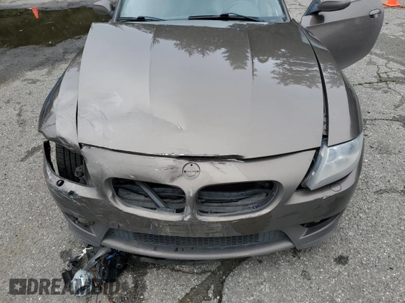 2006 BMW Z4 M z VIN 5UMBT93566LY52187, wystawiony jako Copart lot #54990615 z przebiegiem 88 810 mil mil oraz Szkody całkowita. Historia ofert i sprzedaży dostępna na DreamBid. Obrazek 11.