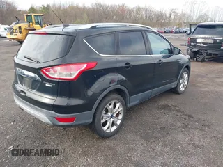2014 Ford Escape Titanium with VIN 1FMCU9J98EUD73818, listed as a IAAI auction lot 42036442 with 129,794 mi miles. Bid and sale history available at carsss.com. Image 4.