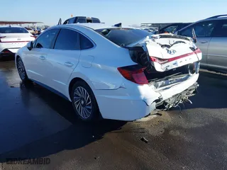 2021 Hyundai Sonata Hybrid SEL with VIN KMHL34JJ0MA024040, listed as a IAAI auction lot 41597221 with 54,891 mi miles. Bid and sale history available at carsss.com. Image 3.