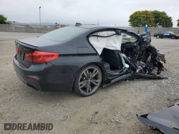 2019 BMW 5 Series M550i xDrive with VIN WBAJB9C53KB464298, listed as a Copart auction lot 59892105 with Not provided miles and Salvage title. Bid and sale history available at DreamBid. Image 3.