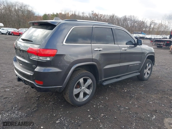2014 Jeep Grand Cherokee Overland with VIN 1C4RJFCG5EC329377, listed as a IAAI auction lot 40822324 with 106,222 mi miles. Bid and sale history available at carsss.com. Image 4.