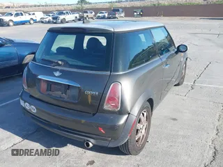 2006 MINI Hardtop with VIN WMWRC33586TJ75043, listed as a IAAI auction lot 41948235 with 138,402 mi miles and . Bid and sale history available at DreamBid. Image 4.