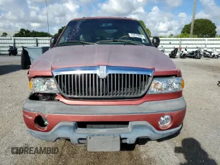 1999 Lincoln Navigator z VIN 5LMRU27A2XLJ41370, wystawiony jako Copart lot #72879004 z przebiegiem Nie podano mil oraz Szkoda całkowita • Salvage title. Historia ofert i sprzedaży dostępna na DreamBid. Obrazek 5.