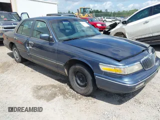 1997 Mercury Grand Marquis GS z VIN 2MELM74W4VX630930, wystawiony jako IAAI lot #42282520 z przebiegiem 86 921 mil mil oraz . Historia ofert i sprzedaży dostępna na DreamBid. Obrazek 1.