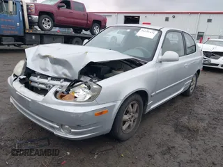 2005 Hyundai Accent GLS with VIN KMHCG35C25U359293, listed as a IAAI auction lot 41233474 with 148,344 mi miles. Bid and sale history available at carsss.com. Image 2.