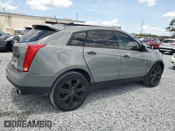 2014 Cadillac SRX Premium Collection z VIN 3GYFNGE30ES627895, wystawiony jako Copart lot #58605985 z przebiegiem 49 300 mil mil oraz Szkoda całkowita • Salvage title. Historia ofert i sprzedaży dostępna na DreamBid. Obrazek 3.