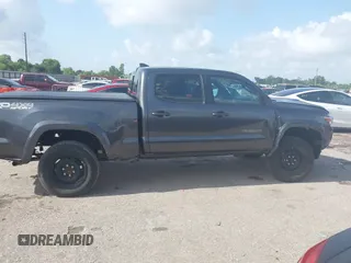 2018 Toyota Tacoma SR5 with VIN 3TMDZ5BN0JM051283, listed as a IAAI auction lot 42438690 with 106,155 mi miles and . Bid and sale history available at DreamBid. Image 13.