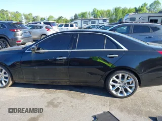2015 Cadillac CTS Premium AWD with VIN 1G6AZ5S35F0129572, listed as a IAAI auction lot 42045670 with 62,758 mi miles and . Bid and sale history available at DreamBid. Image 14.