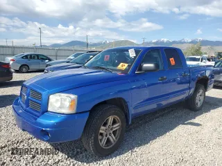 2007 Dodge Dakota SLT z VIN 1D7HW48N07S145519, wystawiony jako Copart lot #56992145 z przebiegiem Nie podano mil oraz Szkoda całkowita • Salvage title. Historia ofert i sprzedaży dostępna na DreamBid. Obrazek 1.