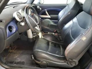 2005 MINI Convertible with VIN WMWRF33485TG10496, listed as a Copart auction lot 58582955 with 107,641 mi miles and Salvage title. Bid and sale history available at DreamBid. Image 7.