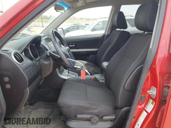 2012 Suzuki Grand Vitara Premium z VIN JS3TD0D20C4101342, wystawiony jako Copart lot #51956595 z przebiegiem 166 710 mil mil oraz Szkody całkowita. Historia ofert i sprzedaży dostępna na DreamBid. Obrazek 7.