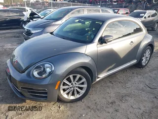 2017 Volkswagen Beetle 1.8T SE with VIN 3VWJ17AT5HM615698, listed as a IAAI auction lot 41099515 with 26,111 mi miles. Bid and sale history available at carsss.com. Image 2.