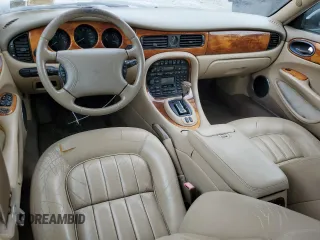 1999 Jaguar XJ with VIN SAJHX1044XC865054, listed as a Copart auction lot 57825325 with 71,145 mi miles and Clean title. Bid and sale history available at DreamBid. Image 8.