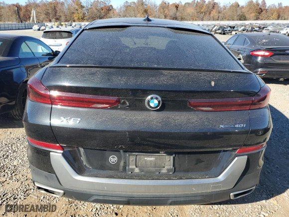 2021 BMW X6 xDrive40i with VIN 5UXCY6C07M9D94944, listed as a Copart auction lot 77106334 with 52,106 mi miles and Salvage Title. Bid and sale history available at carsss.com. Image 6.