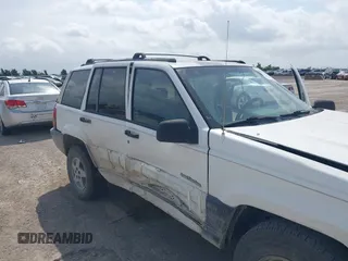 1994 Jeep Grand Cherokee Laredo with VIN 1J4FX58SXRC120936, listed as a IAAI auction lot 42530212 with 126,367 mi miles and . Bid and sale history available at DreamBid. Image 14.