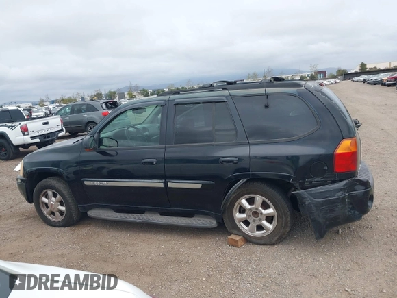 2003 GMC Envoy SLT z VIN 1GKDS13S232298062, wystawiony jako IAAI lot #41668380 z przebiegiem 195 045 mil mil oraz . Historia ofert i sprzedaży dostępna na DreamBid. Obrazek 14.