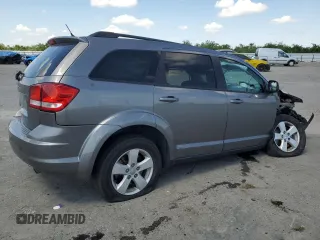 2013 Dodge Journey SE с VIN 3C4PDCAB9DT656887, выставлен на аукционе Copart как лот 54791315 с пробегом 130 394 миль миль и Списание • Salvage title. История ставок и продаж доступна на DreamBid. Изображение 3.