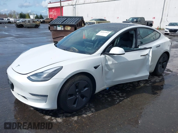 2021 Tesla Model 3 Standard Range Plus z VIN 5YJ3E1EA5MF977437, wystawiony jako IAAI lot #40297512 z przebiegiem 72 039 mil mil oraz . Historia ofert i sprzedaży dostępna na DreamBid. Obrazek 2.