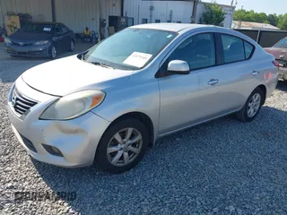 2012 Nissan Versa SV with VIN 3N1CN7APXCL867337, listed as a IAAI auction lot 42079349 with 260,442 mi miles. Bid and sale history available at carsss.com. Image 2.