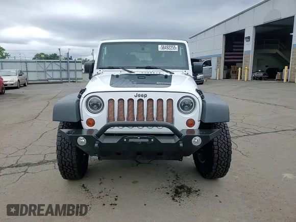 2013 Jeep Wrangler Rubicon 10th Anniversary z VIN 1C4BJWCGXDL543958, wystawiony jako Copart lot #58492255 z przebiegiem 94 455 mil mil oraz Szkoda całkowita • Salvage title. Historia ofert i sprzedaży dostępna na DreamBid. Obrazek 14.