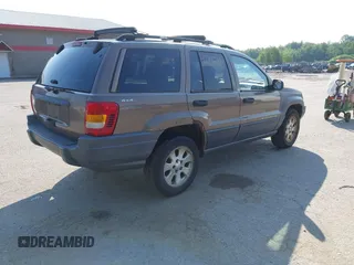 2001 Jeep Grand Cherokee Laredo with VIN 1J4GW48S31C626727, listed as a IAAI auction lot 42796974 with 132,988 mi miles and . Bid and sale history available at DreamBid. Image 4.