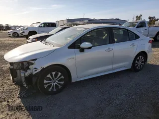 2021 Toyota Corolla Hybrid LE with VIN JTDEAMDE2MJ021576, listed as a Copart auction lot 49916105 with 24,292 mi miles and Salvage Title. Bid and sale history available at carsss.com. Image 1.