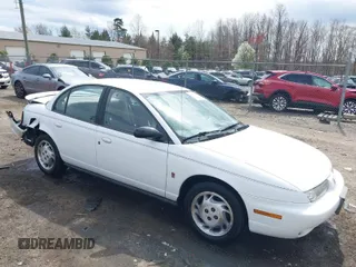 1997 Saturn SL z VIN 1G8ZJ5277VZ383542, wystawiony jako IAAI lot #41880046 z przebiegiem 260 063 mil mil oraz . Historia ofert i sprzedaży dostępna na DreamBid. Obrazek 1.