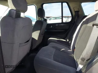 2007 GMC Envoy SLE with VIN 1GKDS13S372241844, listed as a IAAI auction lot 41575443 with 144,726 mi miles. Bid and sale history available at carsss.com. Image 8.