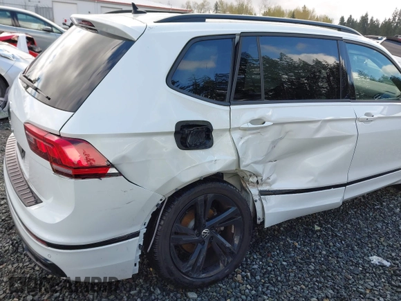 2023 Volkswagen Tiguan SE R-Line Black with VIN 3VVCB7AX3PM014446, listed as a IAAI auction lot 42016885 with 12,726 mi miles and . Bid and sale history available at DreamBid. Image 6.