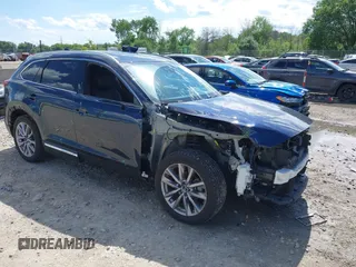 2021 Mazda CX-9 Grand Touring z VIN JM3TCBDY4M0513099, wystawiony jako IAAI lot #42563530 z przebiegiem 76 006 mil mil oraz . Historia ofert i sprzedaży dostępna na DreamBid. Obrazek 1.