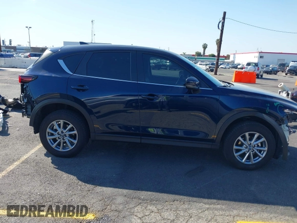 2023 Mazda CX-5 S Carbon Edition z VIN JM3KFBCM7P0197669, wystawiony jako IAAI lot #41992110 z przebiegiem 15 476 mil mil oraz . Historia ofert i sprzedaży dostępna na DreamBid. Obrazek 13.