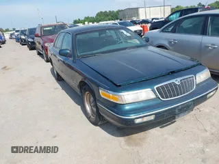 1997 Mercury Grand Marquis GS z VIN 2MELM74W9VX676754, wystawiony jako IAAI lot #42470377 z przebiegiem 167 195 mil mil oraz . Historia ofert i sprzedaży dostępna na DreamBid. Obrazek 1.
