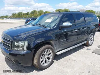 2014 Chevrolet Suburban LS with VIN 1GNSCHE07ER173936, listed as a IAAI auction lot 41967144 with 128,869 mi miles. Bid and sale history available at carsss.com. Image 2.