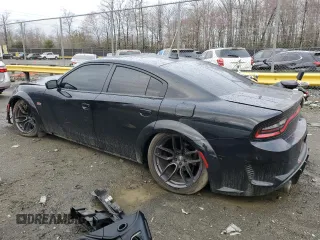 2021 Dodge Charger Scat Pack Widebody with VIN 2C3CDXGJ3MH620792, listed as a Copart auction lot 48355595 with 72,379 mi miles and Salvage Title. Bid and sale history available at carsss.com. Image 2.